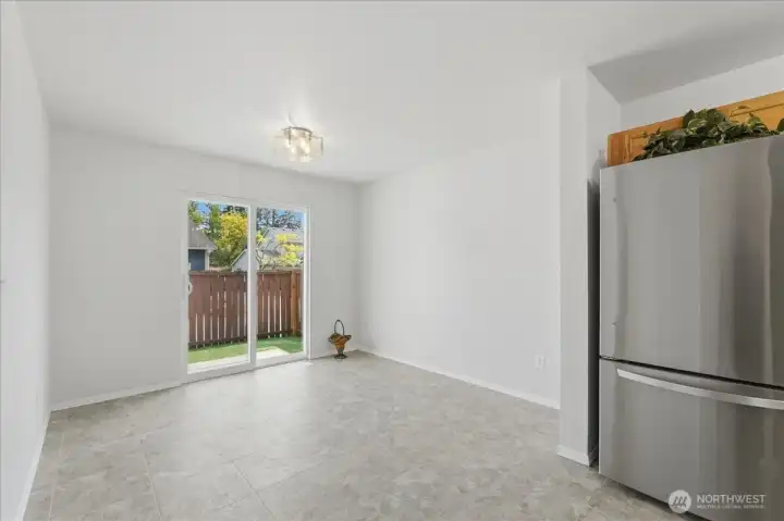 Bright dining space and new light fixtures just installed throughout the entire home.