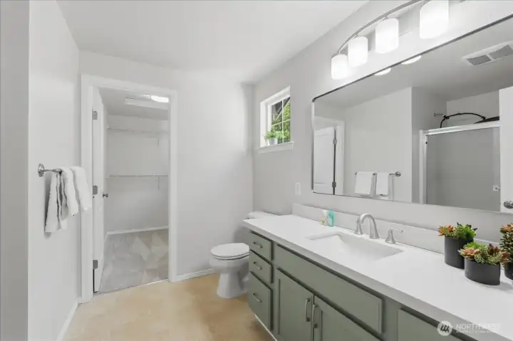 Updated primary bathroom with new sink and walk-in closet