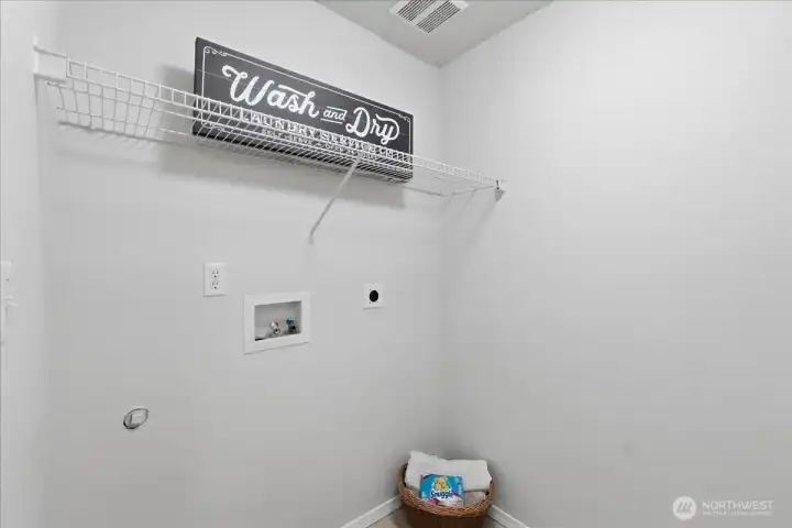 Efficient upstairs laundry space near bedrooms.