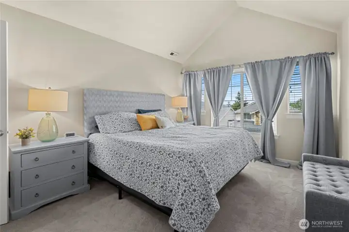 Spacious Primary Suite features Vaulted Ceilings