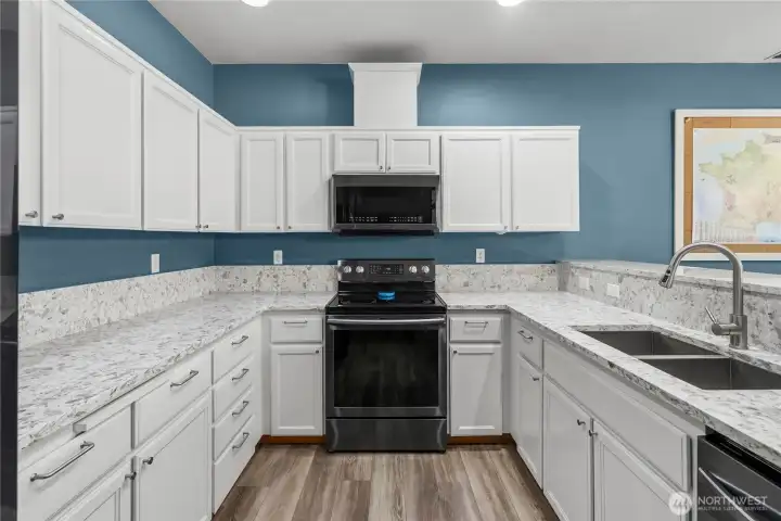 Chef style undermount stainless steel sink and faucet.