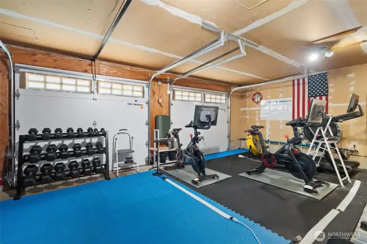 The two car garage is currently being used as a gym The two car garage is currently being used as a gym