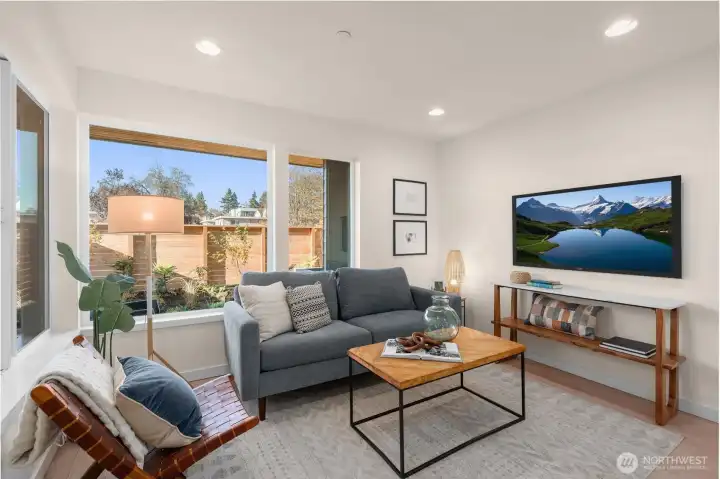 Offering large windows connecting you to your outdoor space as well as a comfortably sized living room that feels seperated from the kitchen Offering large windows connecting you to your outdoor space as well as a comfortably sized living room that feels seperated from the kitchen