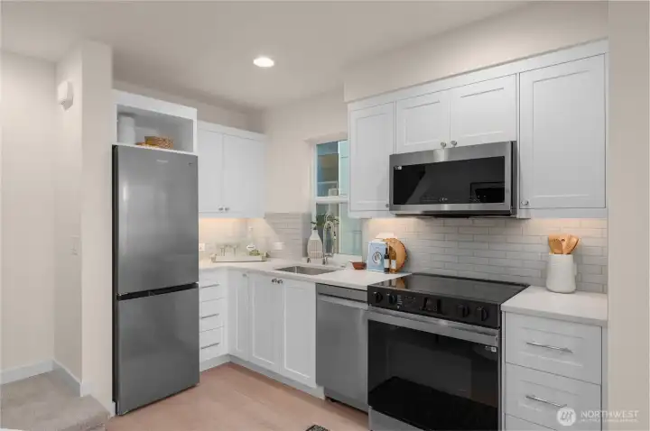The kitchen features a plethora of storage options & counterspace while the organization of the appliances keeps the flow of the kitchen smooth The kitchen features a plethora of storage options & counterspace while the organization of the appliances keeps the flow of the kitchen smooth