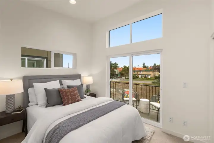 Upstairs, a private retreat awaits- featuring a private balcony & large windows keeping the space feeling airy and light Upstairs, a private retreat awaits- featuring a private balcony & large windows keeping the space feeling airy and light