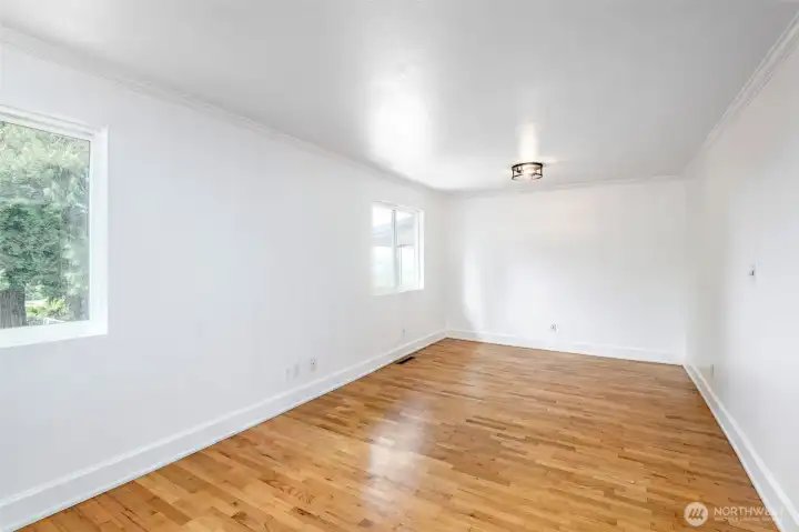 Fabulous North Tacoma location with sweeping Sound views and walking distance to the Proctor District, top-rated schools, Metropolitan Market, waterfront dining, and the waterfront trail. This home shines inside and out, the seller invested in a full kitchen and main-level bathroom remodel, and it shows. The kitchen is stunning, featuring a large island with bar seating, all-new appliances, and abundant cabinetry. The open-concept layout flows seamlessly into the dining and living areas, all beneath soaring tongue-and-groove vaulted ceilings with skylights that flood the great room with warmth and natural light. The daylight basement adds flexible living space, and the three-car garage provides exceptional storage. Despite its convenient location on a main corridor, mature arborvitaes along the front create a peaceful, private feel that virtually blocks street noise. The real hidden gem? A short dead-end alley shared by neighbors leads to an expansive waterfront trail. Fabulous North Tacoma location with sweeping Sound views and walking distance to the Proctor District, top-rated schools, Metropolitan Market, waterfront dining, and the waterfront trail. This home shines inside and out, the seller invested in a full kitchen and main-level bathroom remodel, and it shows. The kitchen is stunning, featuring a large island with bar seating, all-new appliances, and abundant cabinetry. The open-concept layout flows seamlessly into the dining and living areas, all beneath soaring tongue-and-groove vaulted ceilings with skylights that flood the great room with warmth and natural light. The daylight basement adds flexible living space, and the three-car garage provides exceptional storage. Despite its convenient location on a main corridor, mature arborvitaes along the front create a peaceful, private feel that virtually blocks street noise. The real hidden gem? A short dead-end alley shared by neighbors leads to an expansive waterfront trail.
