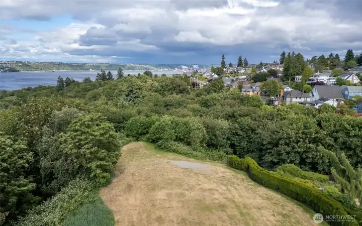 The real hidden gem? A short dead-end alley shared by neighbors leads to an expansive waterfront trail and a wide-open grass field with close-up views of Commencement Bay, perfect for watching the Fourth of July fireworks or a sunny afternoon with your dog. The real hidden gem? A short dead-end alley shared by neighbors leads to an expansive waterfront trail and a wide-open grass field with close-up views of Commencement Bay, perfect for watching the Fourth of July fireworks or a sunny afternoon with your dog.