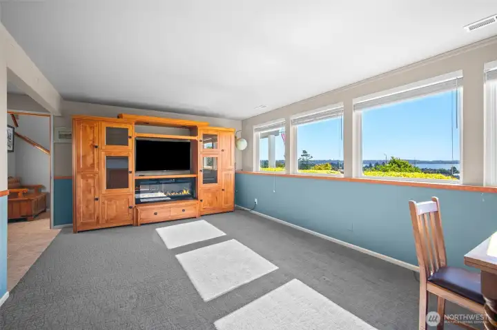 There is an electric fireplace in the downstairs bonus room. There is an electric fireplace in the downstairs bonus room.