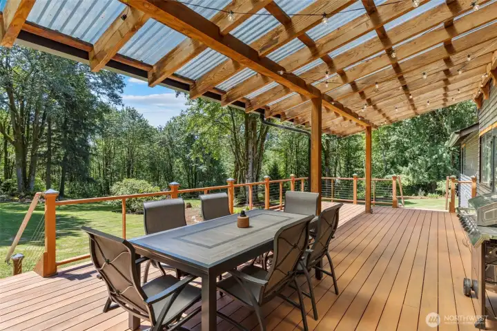 Large covered deck overlooking the back yard