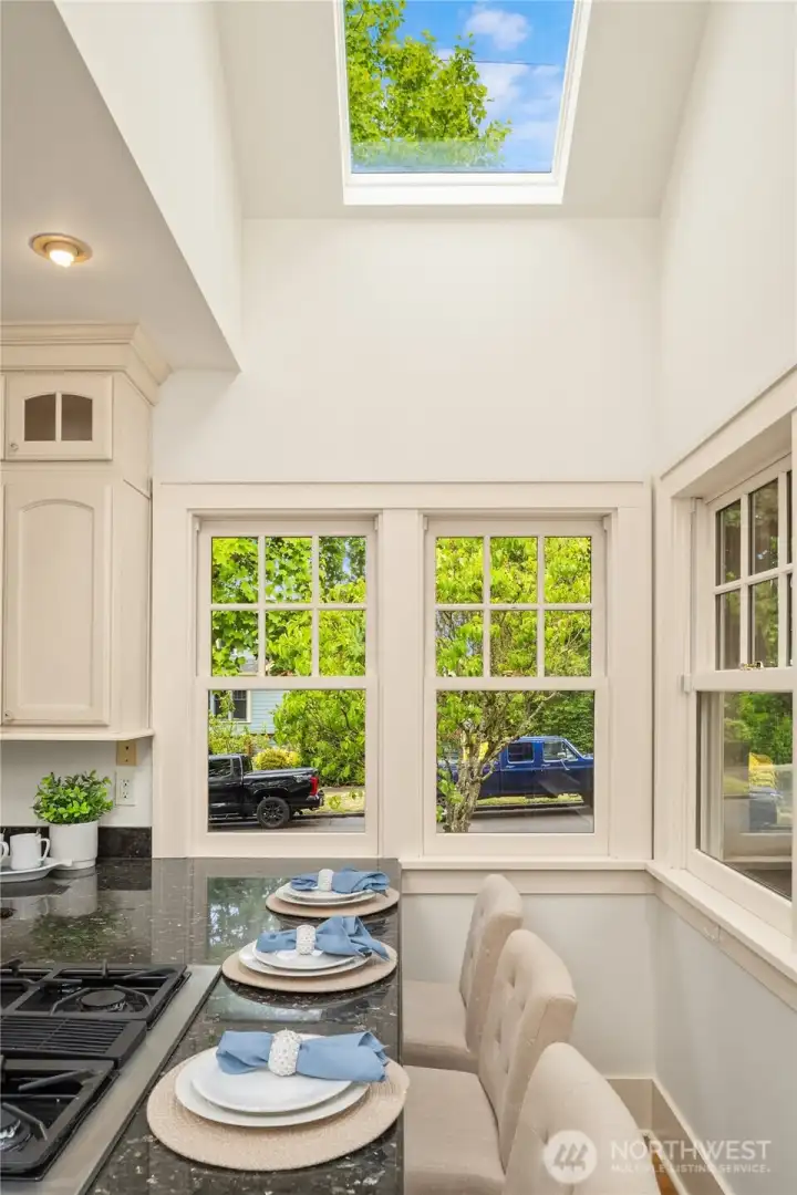 The breakfast bar is surrounded by windows and overhead skylights - a wonderful place to enjoy morning coffee!