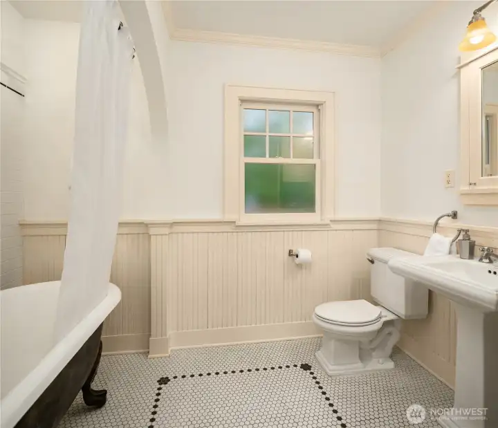 The bathroom was remodeled the same year as the kitchen. There's new plumbing and wiring in the walls, while its old world character was carefully preserved.