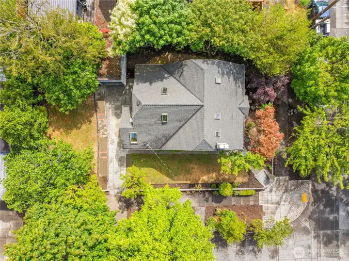 Aerial view of house and old garage.