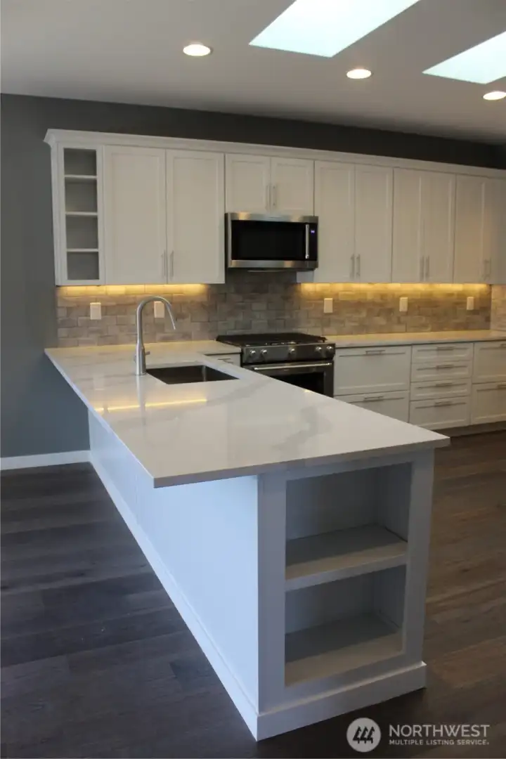 Kitchen Peninsula, White Shaker Kraft Maid custom cabinets. Kitchen Peninsula, White Shaker Kraft Maid custom cabinets.