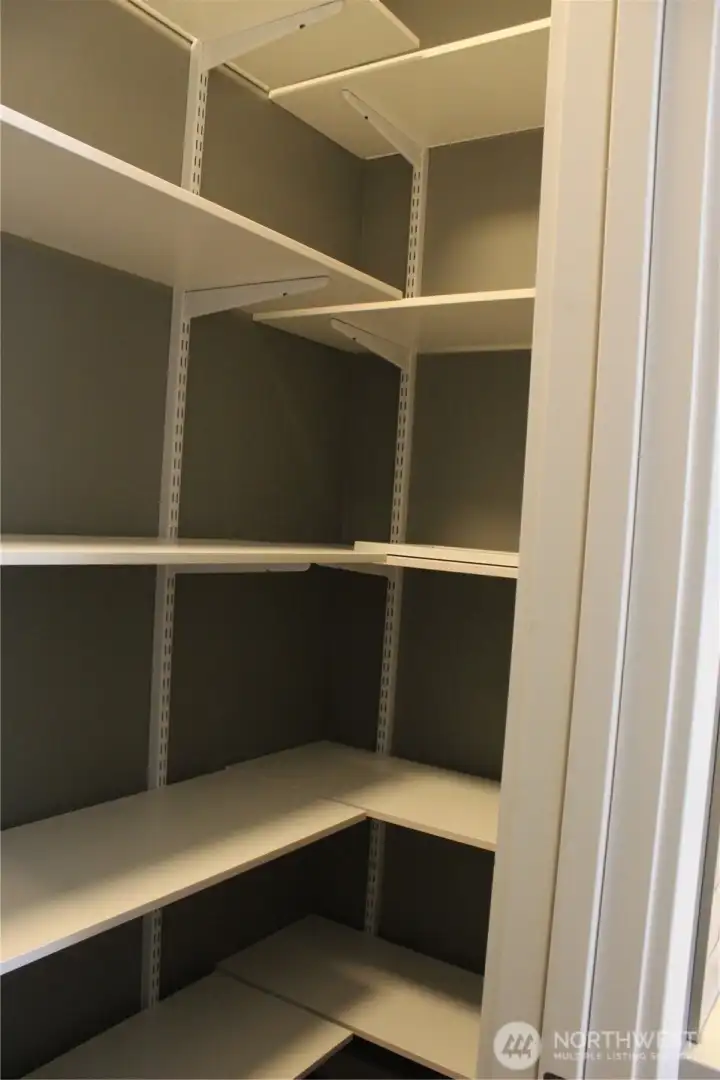 Walk in pantry with Organized Living Premium adjustable wood shelving Walk in pantry with Organized Living Premium adjustable wood shelving