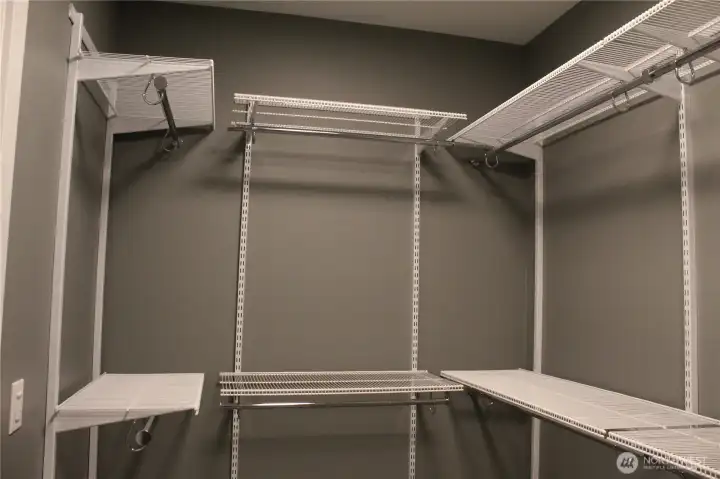 Master walk in closet with Organized Living Premium Adjustable Shelving Master walk in closet with Organized Living Premium Adjustable Shelving
