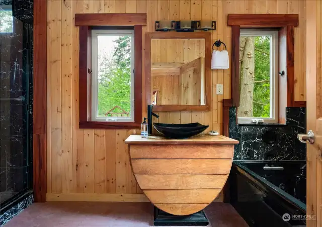 The downstairs ensuite bathroom with large soaking tub and shower.