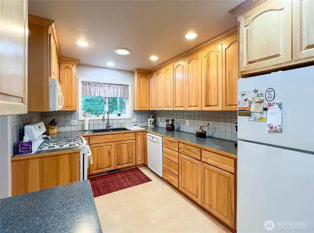 Kitchen with lots of counter space. Also all hickory cabinets that extend to the ceiling. Also, features propane stove and range.