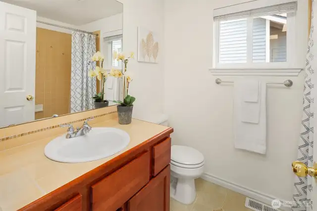 The hall bath serving the two secondary bedrooms.