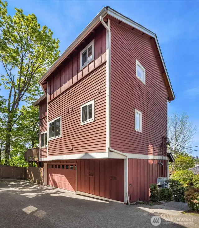 The home includes a two-car attached garage AND a dedicated spot (to the left of the garage).