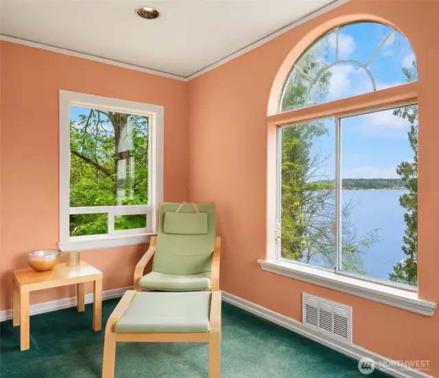Sitting area in primary with a large walk-in closet to the left.