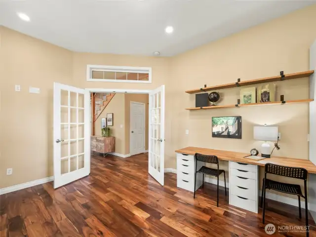 Office w/gas fireplace & French doors, built in desks