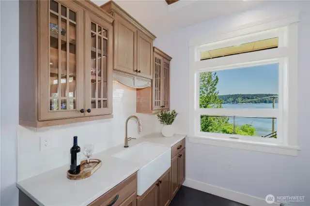 Great for entertainment the cherry wood kitchenette open to dining and recreation room on the lower floor, has farm house sink, touchless faucet and refrigerator.