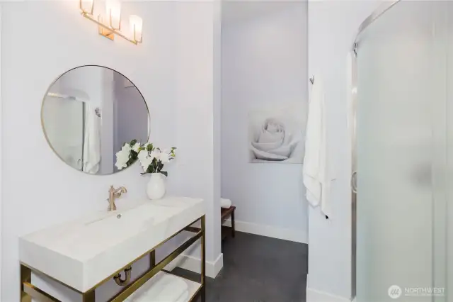 Connected to the recreation/family room a 3/4 bath. An outlet is provided at the toilet for a future bidet and separate 240V circuit for a future steam shower.