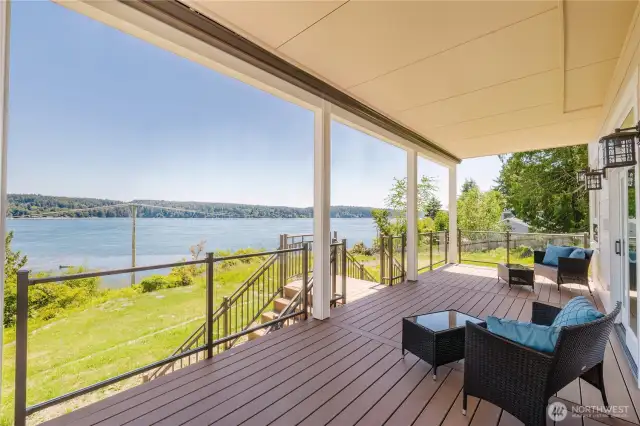 Doors are out from the recreation/family room to the very capacious deck. Stairs are leading down to the yard and storage space under the deck. The views are equally as stunning from this deck.