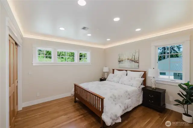 Second bedroom on the upper floor. Beautiful cherry wood floors and doors throughout the upper floor bedrooms.