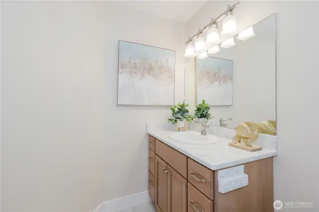 Another full bath with quartz counter tops and air jet tub, shower and fully automated bidet toilet on the upper floor.