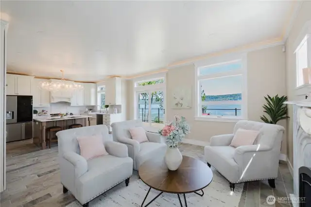 Living room open to the kitchen , views from every window and access to the huge deck. Ceramic tile floors throughout.