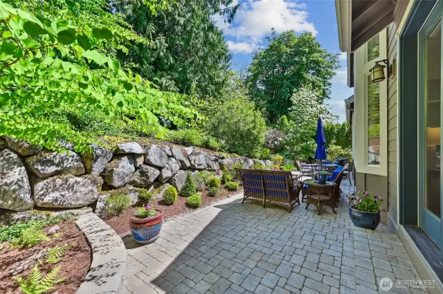 The stunning paver patio was installed in 2021 and runs the length of the home. It enjoys sun in the morning and part of the afternoon and is a great place to relax in the heat of the day.