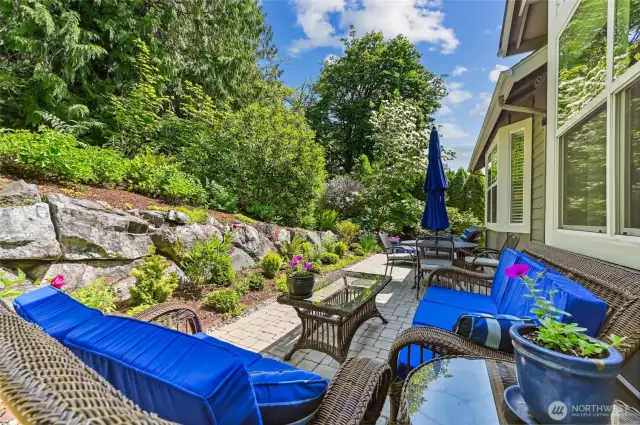Nicely landscaped garden beds and the green space buffer is a very pretty backdrop. There are three blueberry bushes that produce a lot of berries!