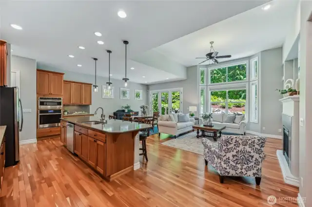 The Hemlock has a fabulous great room that is great for entertaining or a quiet evening at home. The walls of windows bring in lots of natural light and the greenspace behind the home provides a lush backdrop.