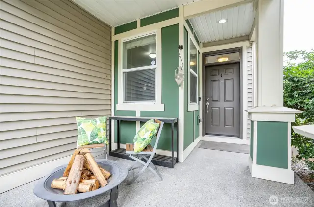 Spacious and welcoming covered front patio, perfect for relaxing evenings or entertaining guests.