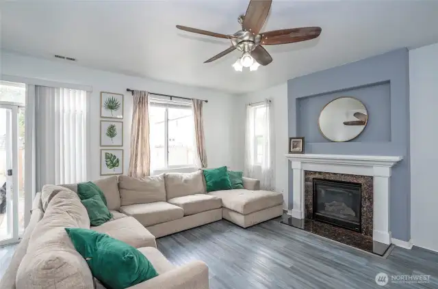 The family room offers a cozy retreat with a gas fireplace—perfect for chilly PNW days.