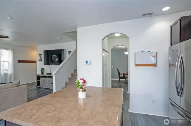 From the kitchen, enjoy a clear view of the family room, while the hallway to the right provides easy access to the dining area—perfect for effortless flow and entertaining.