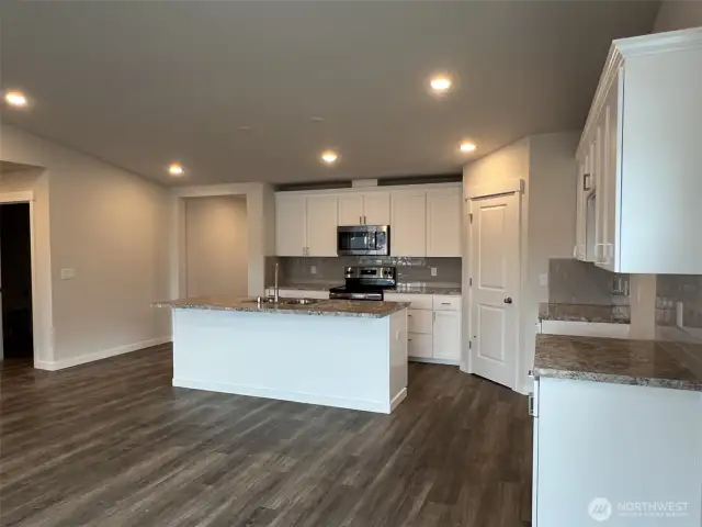 Kitchen and Hallway to Primary Suite