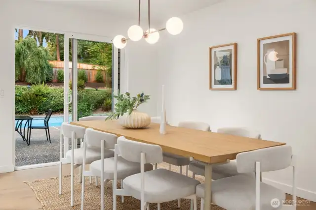 Dining room looks out to the enchanting backyard.