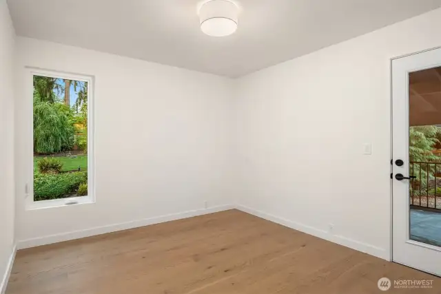 Two more bedrooms on the upper level, this one with it's own covered deck that looks out to the pool.