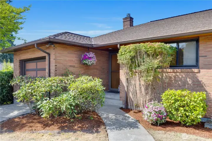 The home features an easy two-step entry from the front walkway into the main level. Extra features are the cedar lined covered front entry, and the private sidelight by the front door.