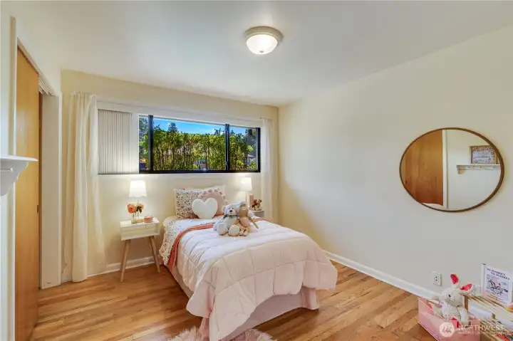The second bedroom also looks over the front yard. Both main floor bedrooms feature a double closet with ample space for wardrobe and shoes.