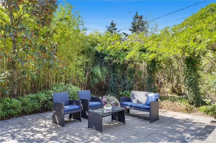 This spacious patio is ideal for backyard parties, eating al fresco, or inviting friends to a summer barbeque.
