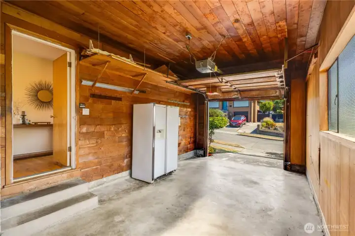 Plenty of room for your kayaks, paddleboards, and fishing poles to enjoy on the Puget Sound nearby! In the back of the garage are built-in storage cupboards, which can remain for your use or removed to create more space.
