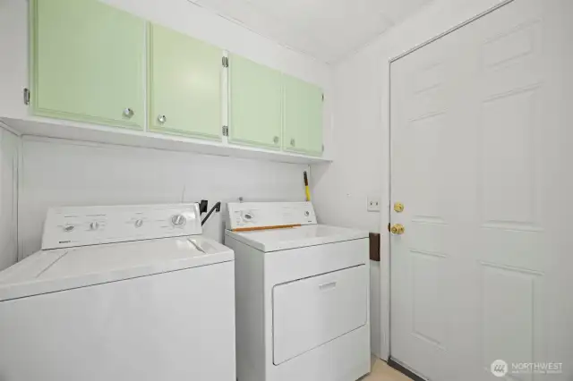 Mudroom with a door leading out to the side of the house.