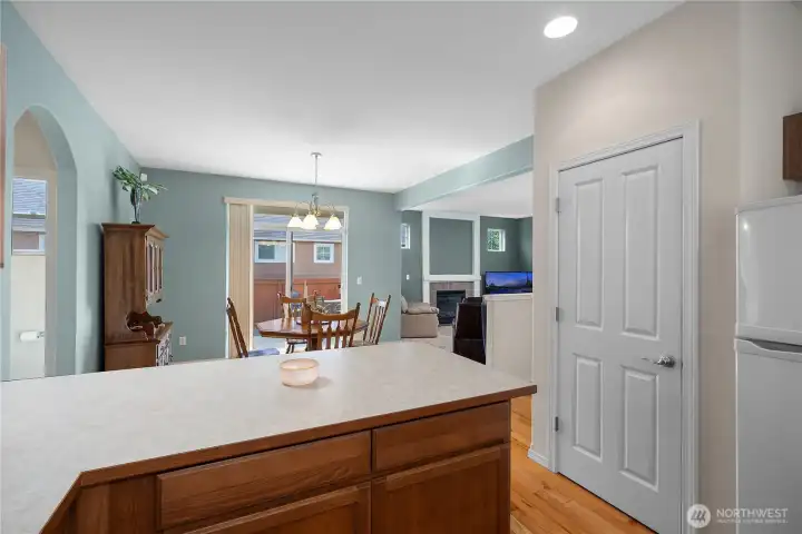 Kitchen with new dishwasher installed in July, hardwood floors and pantry.