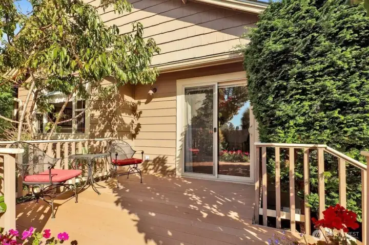 Side deck overlooks beautiful raised gardens.