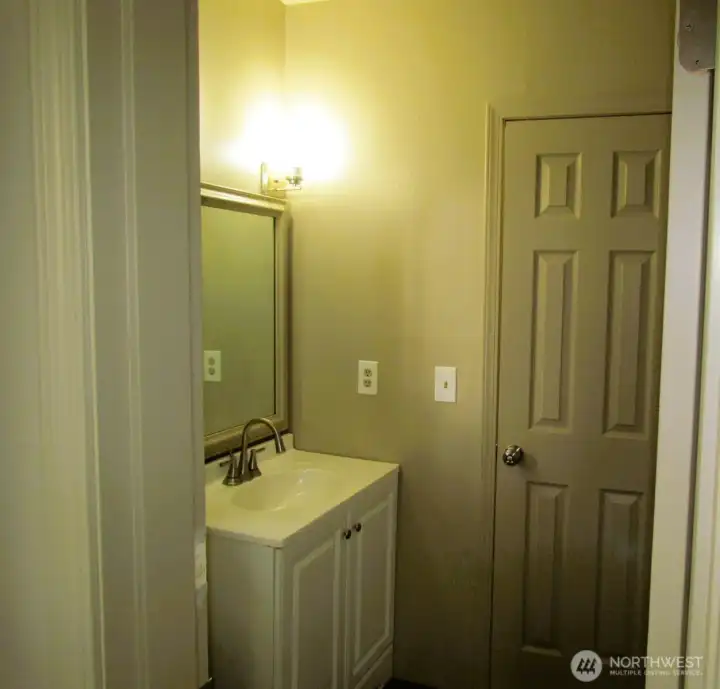 Jack and Jill bathroom with a full bathtub and shower.