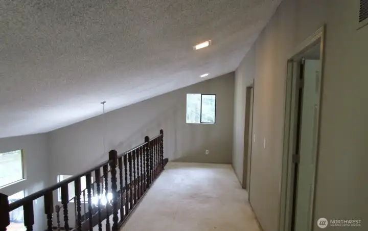 Loft outside the first bedroom, nice open space.