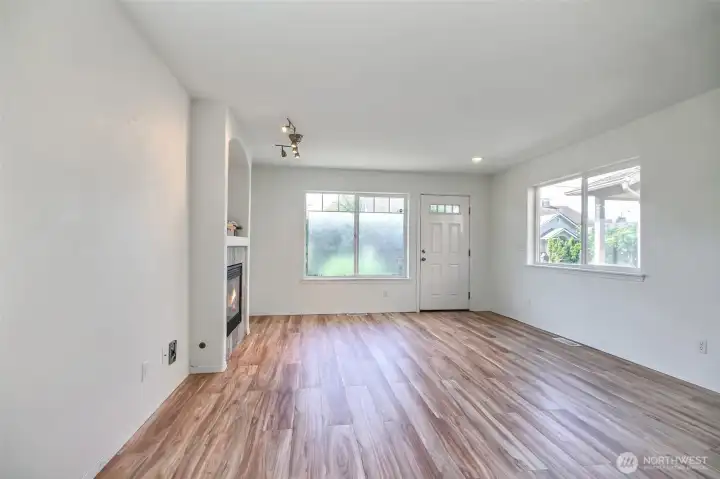 Looking back from the dining area toward the front entry door